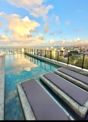 Flat completo - Até 2 Pessoas - Unidade com Jacuzzi privativa e área comum com visão para o mar